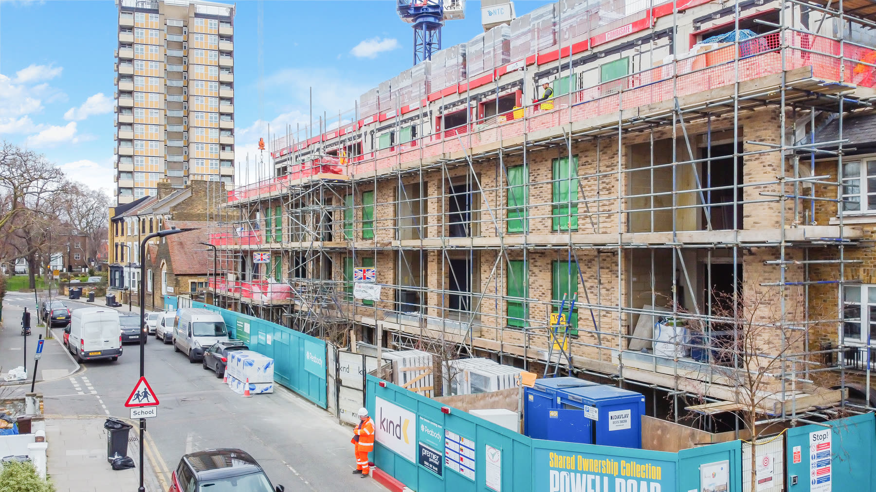 Powell Road under construction, side-angle view with hoarding