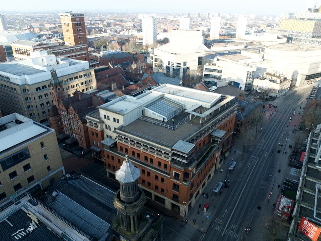 Birmingham commercial building, wide aerial with city context