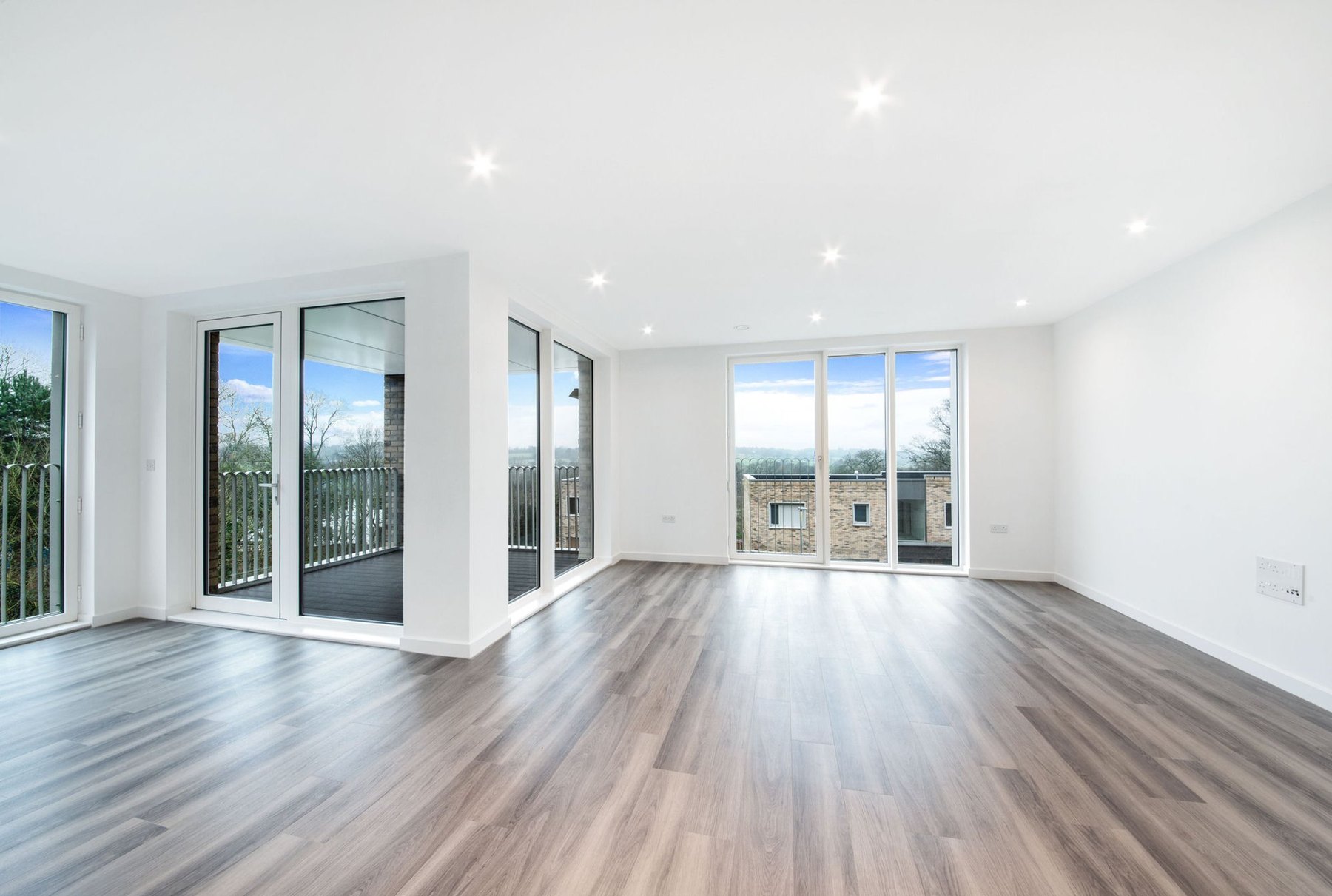 Empty modern apartment living area before virtual staging